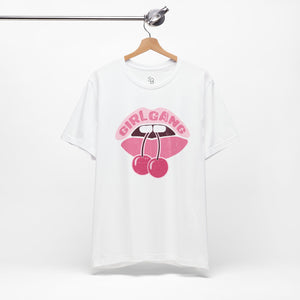 White t-shirt with pink graphic design on a hanger against a white background