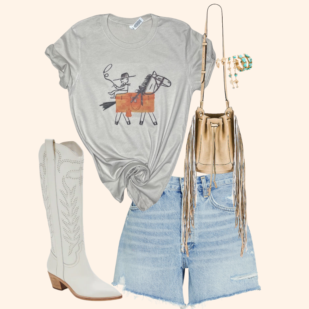 Cowgirl t shirt styled with fringe bag, denim shorts, and white cowboy boots for a rodeo-inspired outfit.
