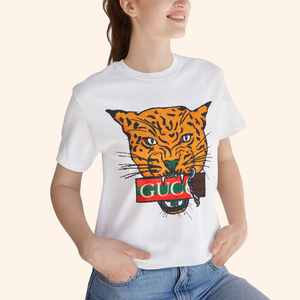 Close-up of model wearing All Mine Street Style Graphic Tee with bold tiger design on white cotton shirt styled with casual denim jeans