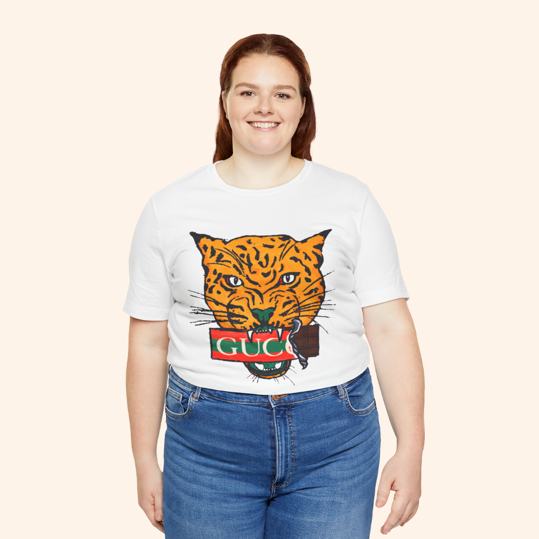 Plus size model wearing All Mine Street Style Graphic Tee in white featuring bold orange tiger print, confident casual fashion look