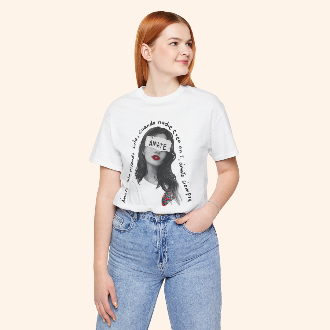 Model wearing white Amate graphic tee with jeans, standing confidently. Shows quote design placement and casual streetwear styling.