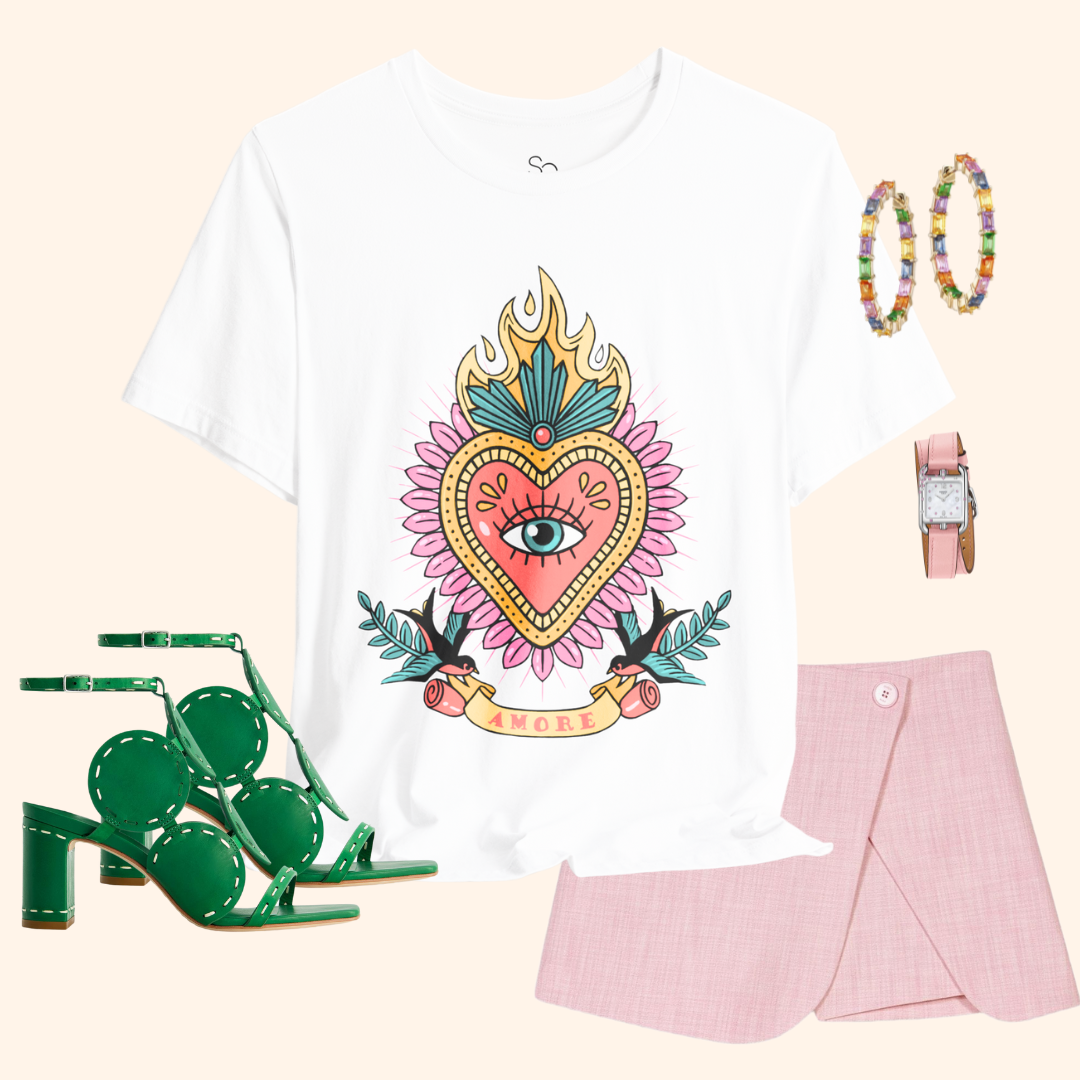 Styled outfit flat lay: white Amore graphic tee with pink mini skirt, green heeled sandals, hoop earrings, blush watch; chic street style set.