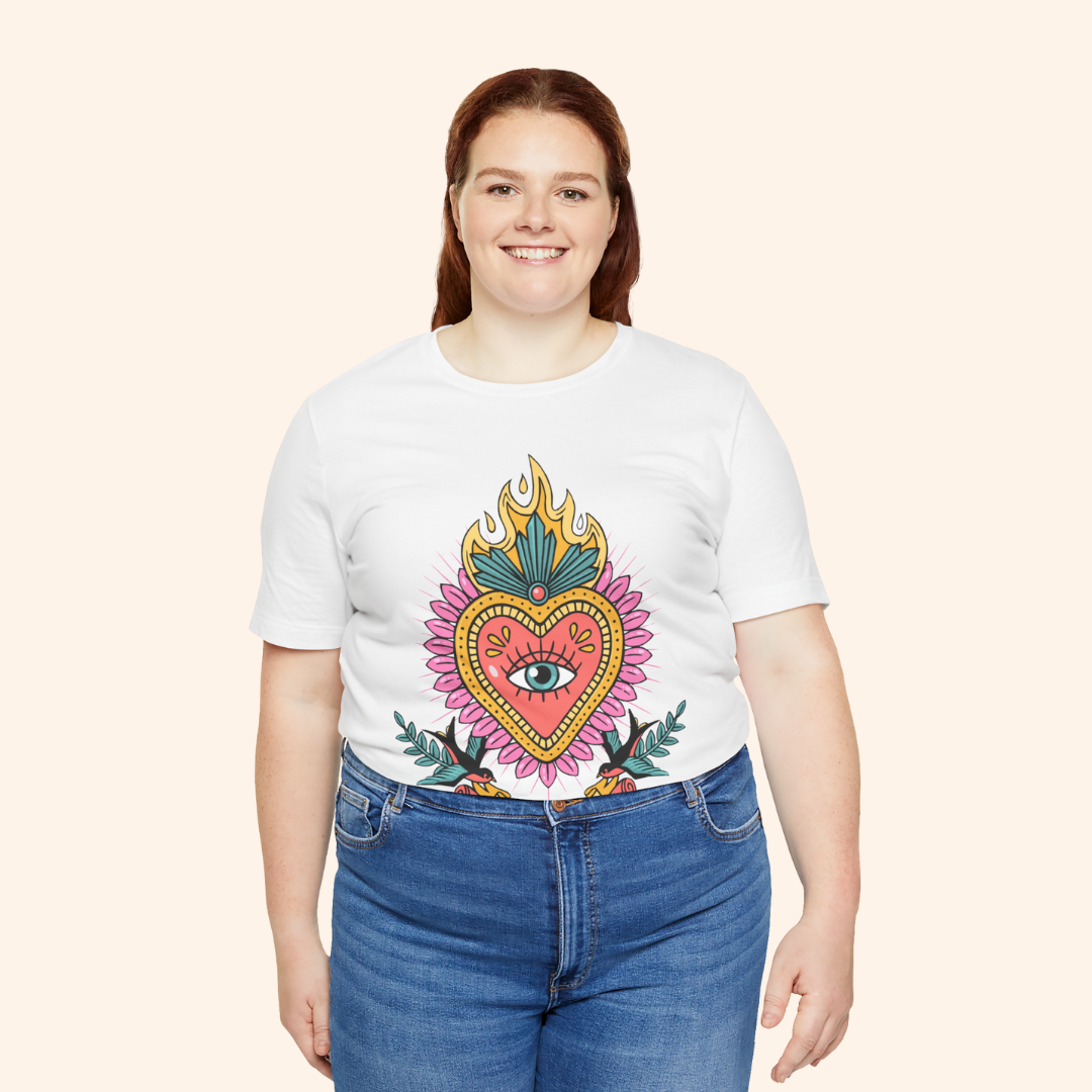 Plus-size model in white sacred heart graphic tee; inclusive unisex fit with vivid multicolor design and casual street style vibe.