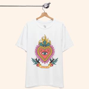 White Amore T-Shirt on hanger from metal rod, full sacred heart graphic visible; clean studio shot of unisex graphic t-shirt.