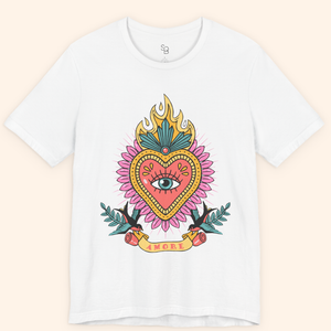 Front-on flat lay of white Amore T-Shirt with bold pink and gold heart, teal flames, and banner reading Amore; modern graphic tee.