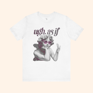 White unisex graphic tee laid flat on beige background featuring angel with sunglasses and “ugh. as if” quote, styled for modern streetwear look.