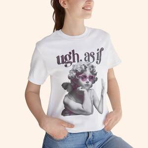 Close-up of model wearing the “ugh. as if” graphic tee, focusing on angel print and pink sunglasses detail, styled with light denim jeans.