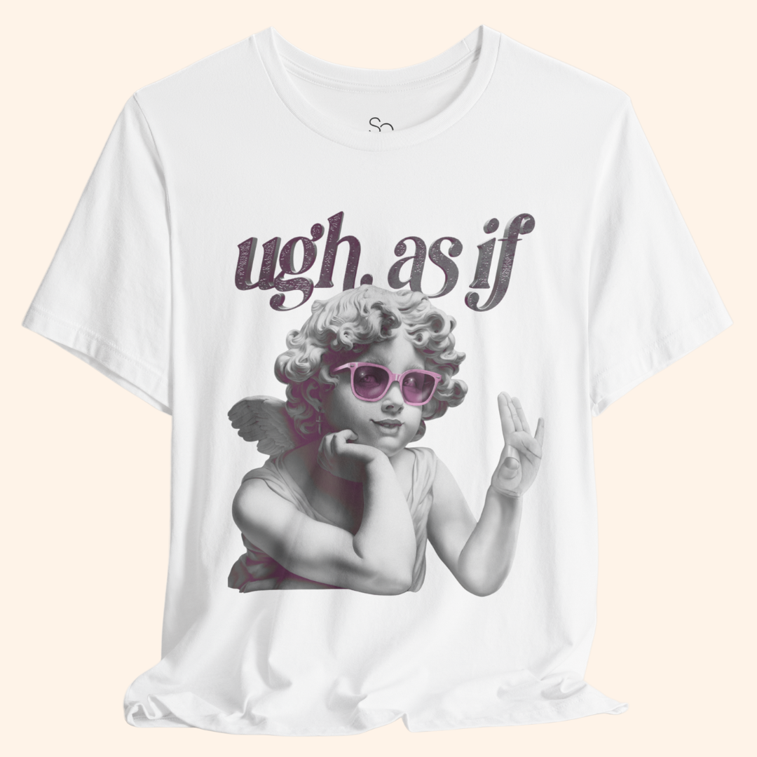Close-up of white graphic tee with “ugh. as if” text and angel wearing pink sunglasses. Focus on detailed print and soft cotton texture.