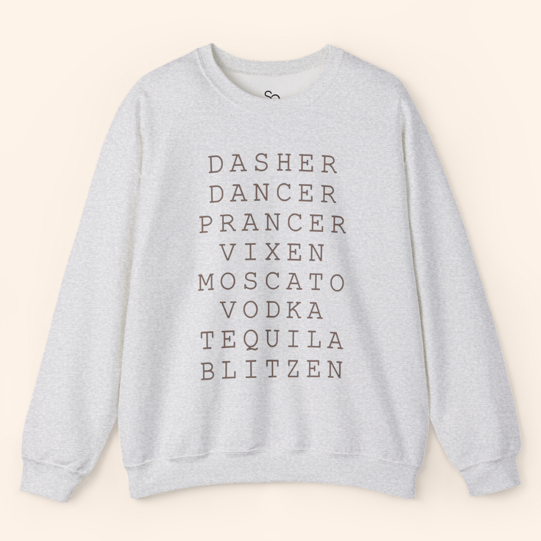 Solo product shot of the heather gray Reindeer Fun sweatshirt laid flat on a neutral background; ribbed crewneck, long sleeves, and stacked black text centered across the chest.