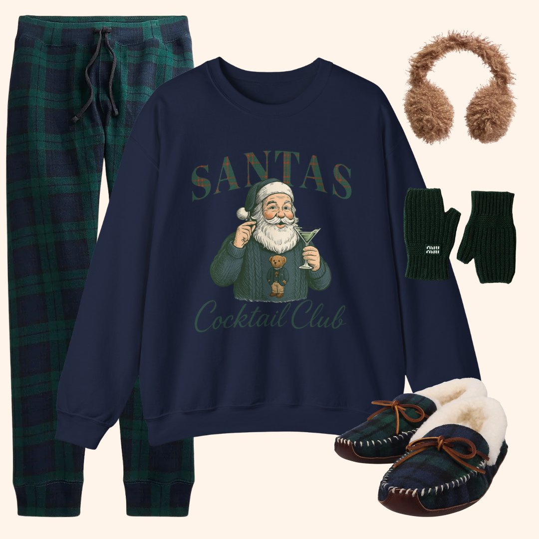Cozy winter themed flat lay with navy Santas Cocktail Club sweatshirt, plaid loungewear pants, fuzzy earmuffs, fingerless gloves, and warm plaid slippers.