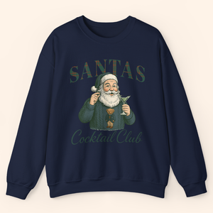 Navy holiday graphic sweatshirt featuring a vintage style Santa holding a martini with plaid lettering that reads Santas Cocktail Club, displayed as a flat lay on light background.