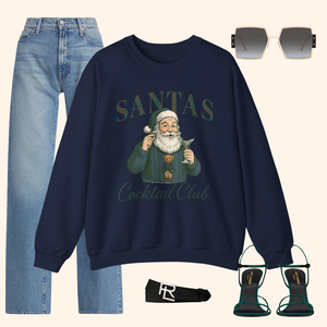 Outfit layout featuring navy Santas Cocktail Club holiday sweatshirt paired with light denim, green heels, sunglasses, and belt for an elevated festive look.