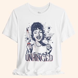 Close up view of the Unhinged tee chest graphic, focusing on the vintage housewife face, pearl necklace, and distressed navy and red illustration with subtle splatter, highlighting print quality on this dark humor streetwear top.