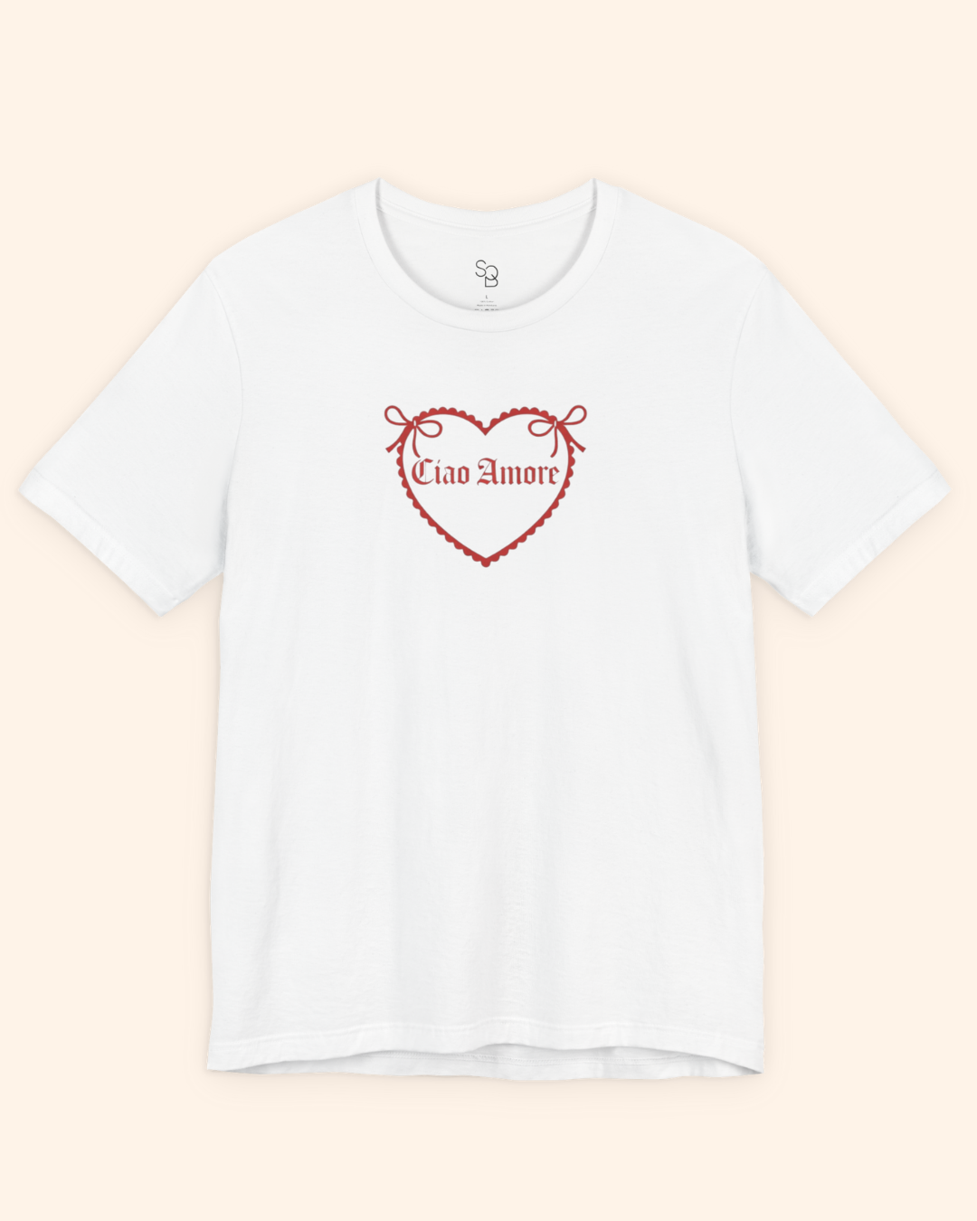 Overhead flat lay of white heart graphic t shirt photographed on a neutral background, highlighting the clean design.