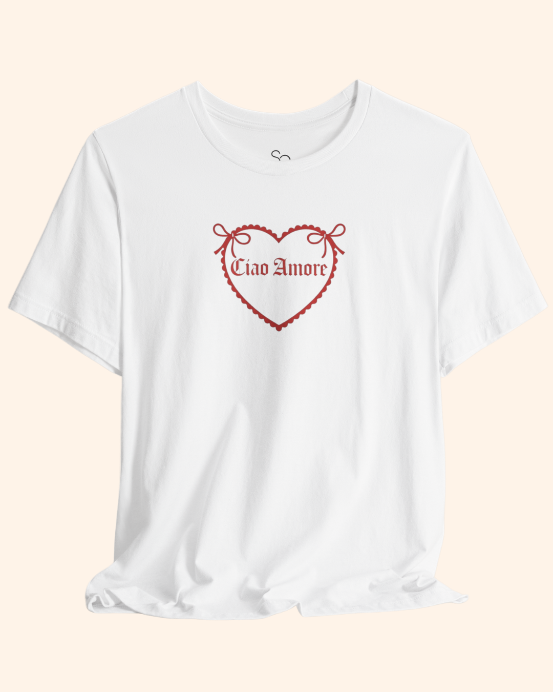 Close up of red heart graphic and lettering printed on white cotton graphic t shirt, showing fabric texture and print detail.