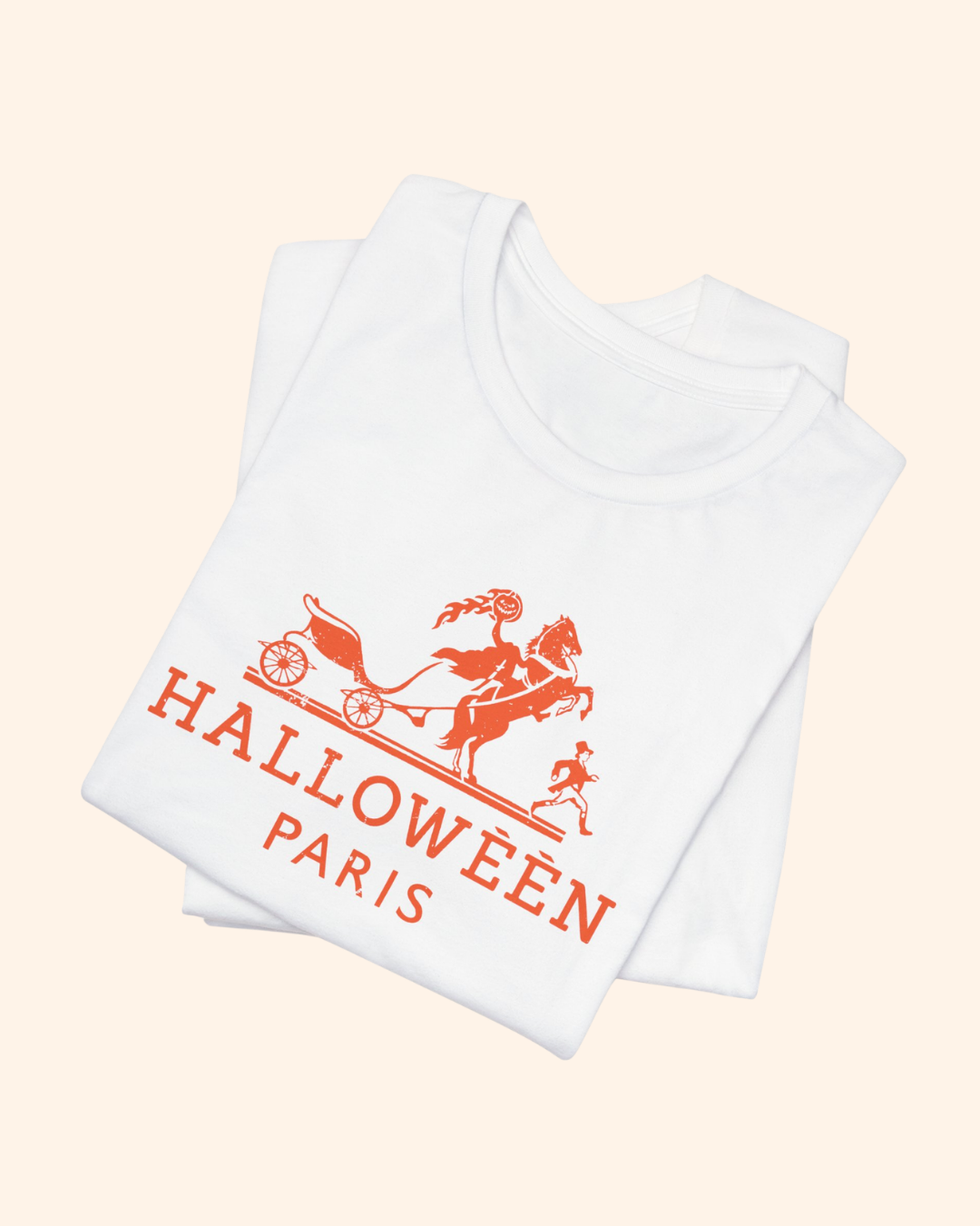 Folded white Midnight in Paris Halloween graphic tee showing the front artwork