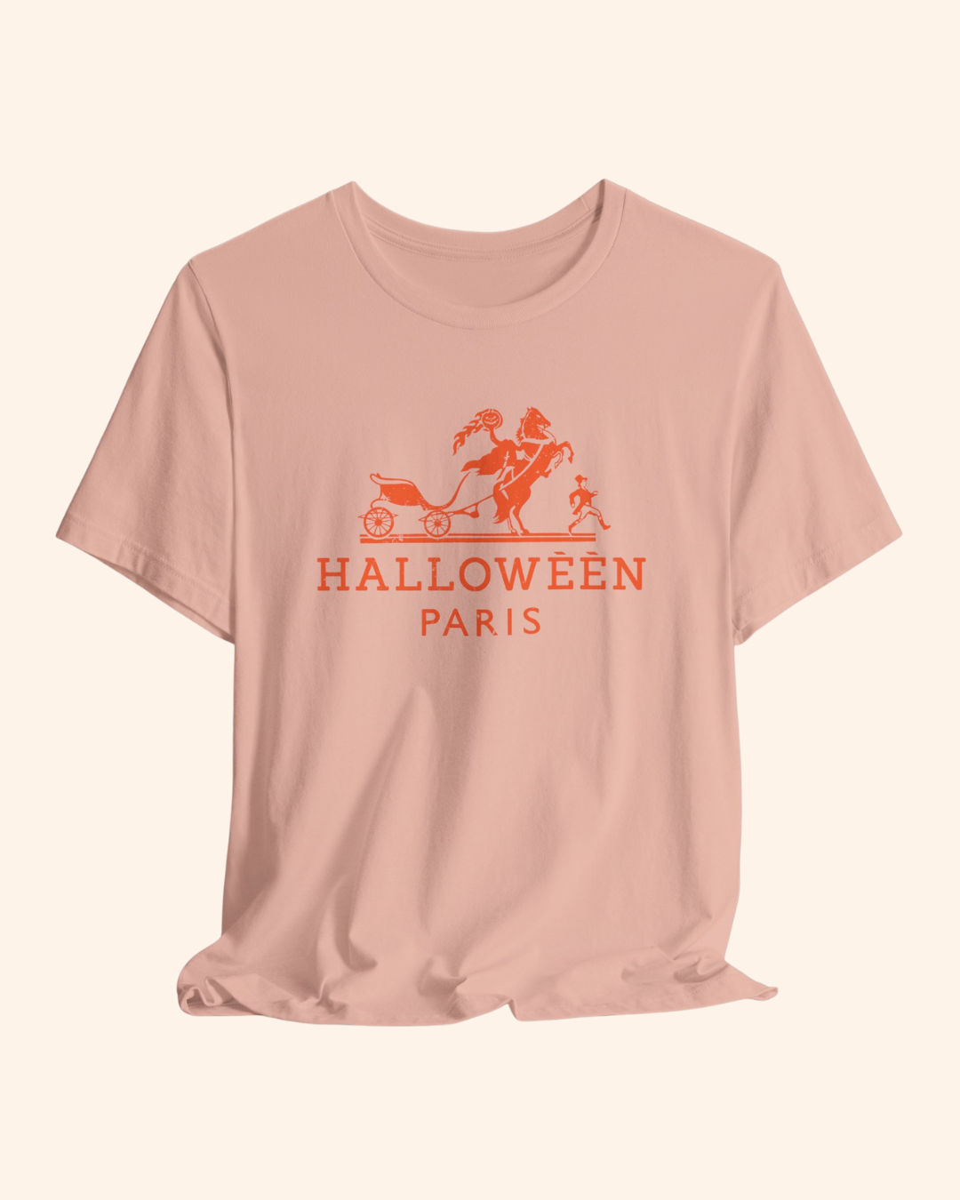 Peach Midnight in Paris graphic tee with coral-orange horse-drawn carriage artwork