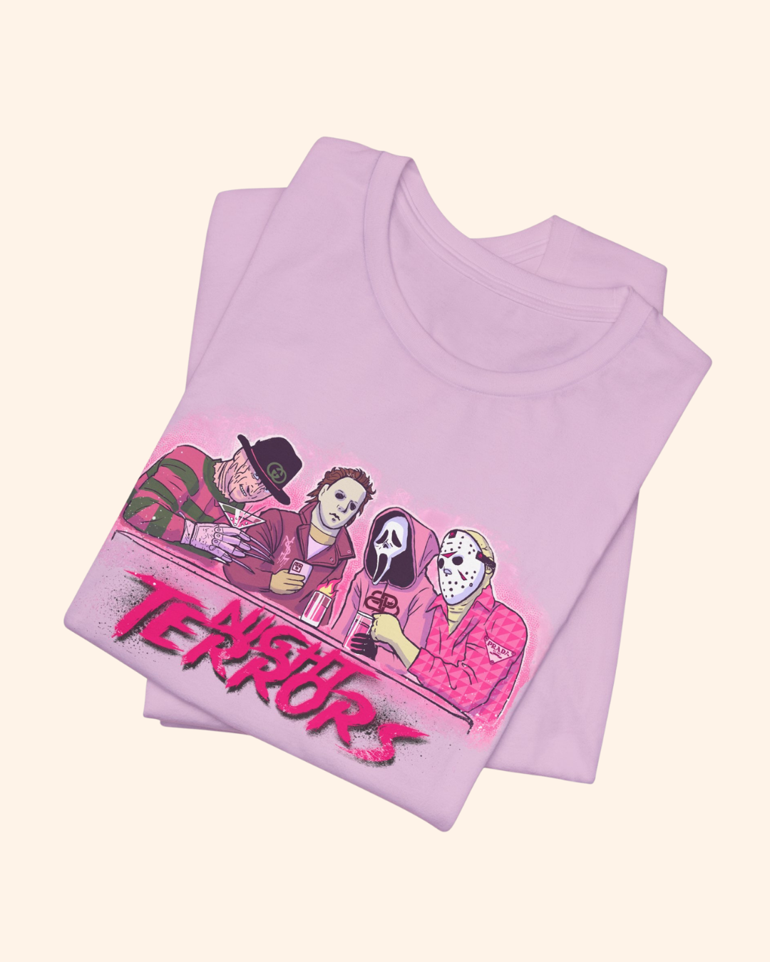 Folded Lilac Night Terrors graphic tee with pink monochrome artwork
