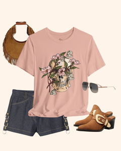 Peach Spring With You botanical skull graphic tee styled with denim shorts and brown accessories