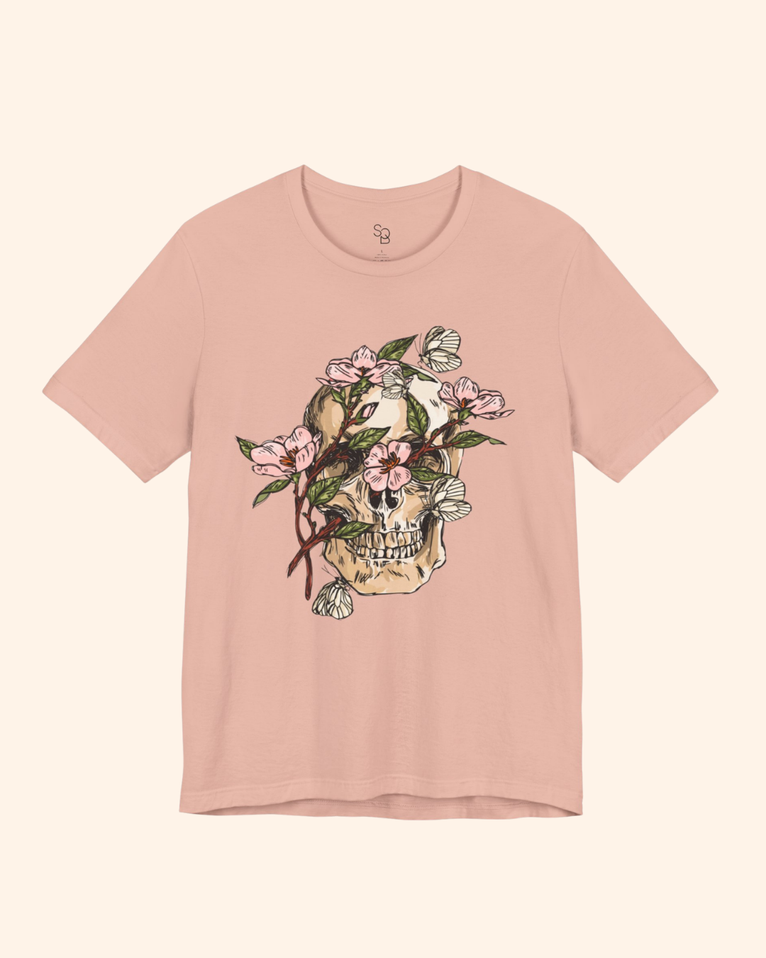 Peach Spring With You tee with skull, pink flowers, green leaves, and butterflies
