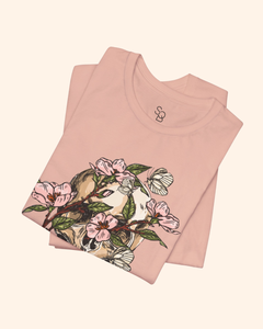 Folded Peach Spring With You tee showing the floral skull artwork