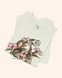 Folded Citron Spring With You tee showing flowers, leaves, and butterfly details