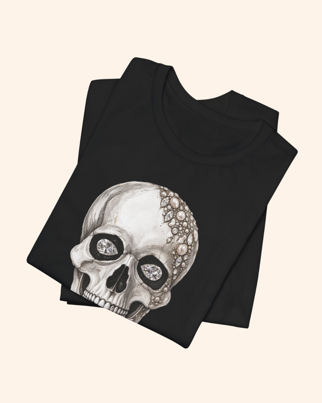 Folded black Shine Bright graphic tee with jeweled skull artwork