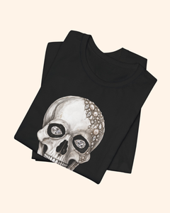 Folded black Shine Bright graphic tee with jeweled skull artwork