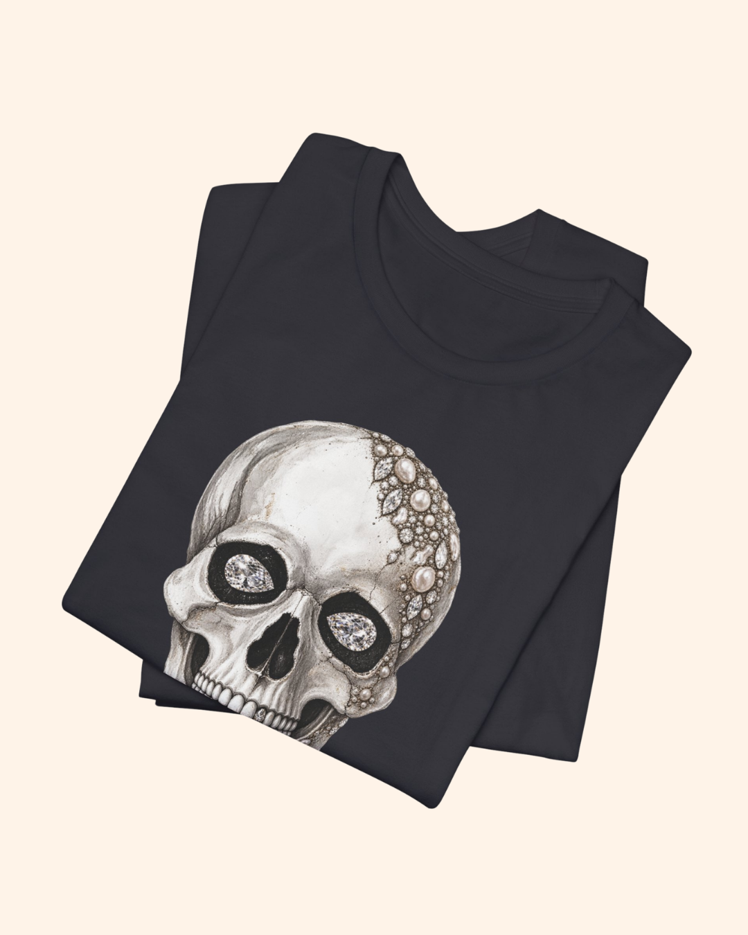 Folded Dark Grey Shine Bright graphic tee showing the jeweled skull design