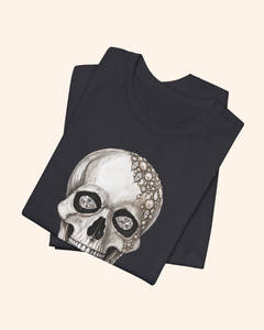 Folded Dark Grey Shine Bright graphic tee showing the jeweled skull design