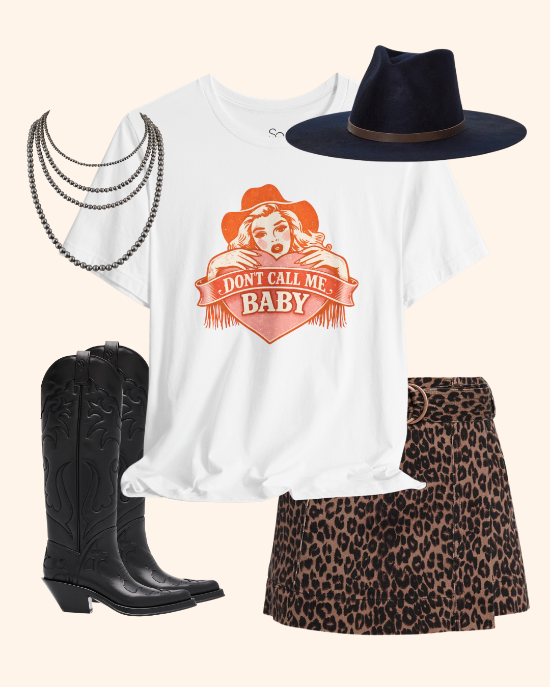 Styled flat lay of white Don’t Call Me Baby western graphic t-shirt with boots, hat, and accessories.