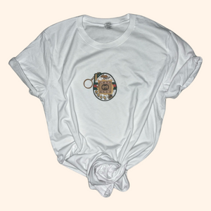 Alt Text: Flat lay of white graphic t-shirt featuring digital pet design, soft cotton fabric with vintage Y2K style aesthetic.

