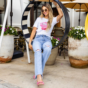 Close-up of Girl Gang tee styled with jeans and sunglasses, casual bestie outfit with cherry graphic.