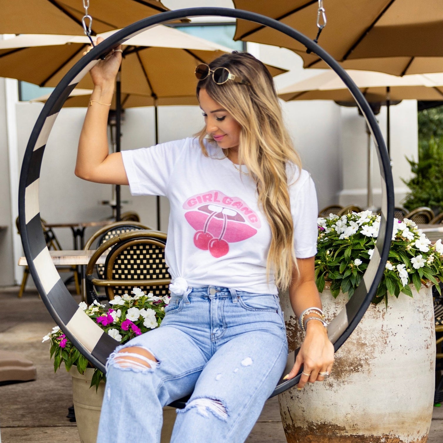 Streetwear-inspired look with Girl Gang graphic tee and denim, outfit for stylish women and best friends.