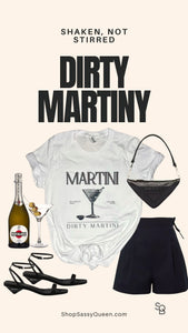 Dirty Martini graphic tee poster featuring the phrase “Shaken, Not Stirred” with styled outfit accessories.

